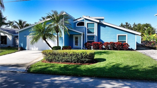 view of front facade featuring a garage and a front lawn