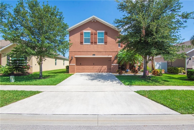 view of front of house with a front lawn and a garage