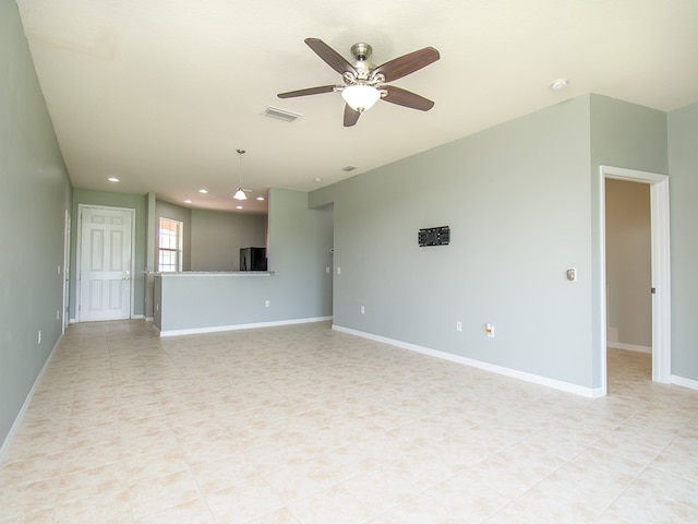 unfurnished living room featuring recessed lighting, visible vents, a ceiling fan, light tile patterned flooring, and baseboards