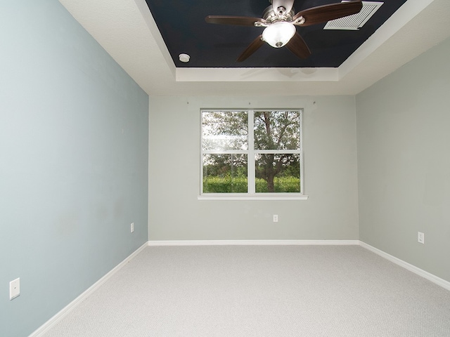351 Monaco Pl, Vero Beach, FL 32960 - unfurnished room with a raised ceiling, carpet floors, and a ceiling fan