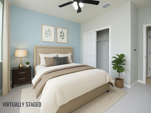 bedroom featuring carpet, visible vents, a closet, baseboards, and ceiling fan