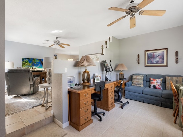 tiled home office featuring ceiling fan