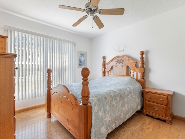 bedroom featuring ceiling fan and light hardwood / wood-style flooring