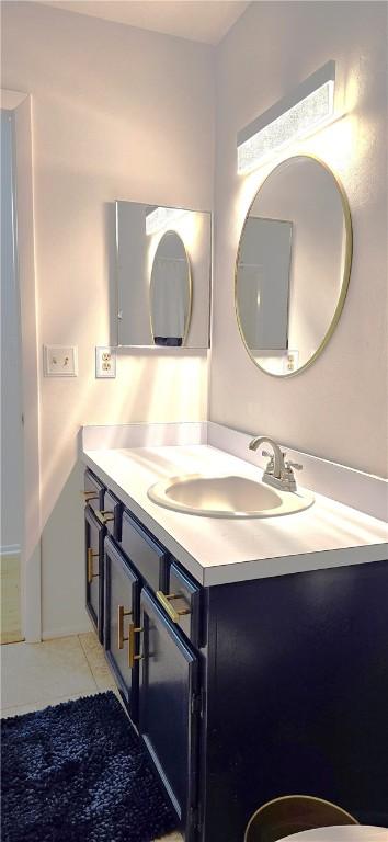 bathroom with vanity and tile patterned floors