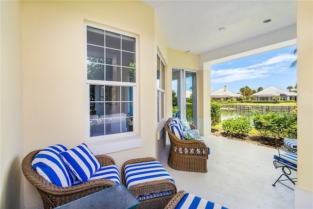 sunroom with a water view