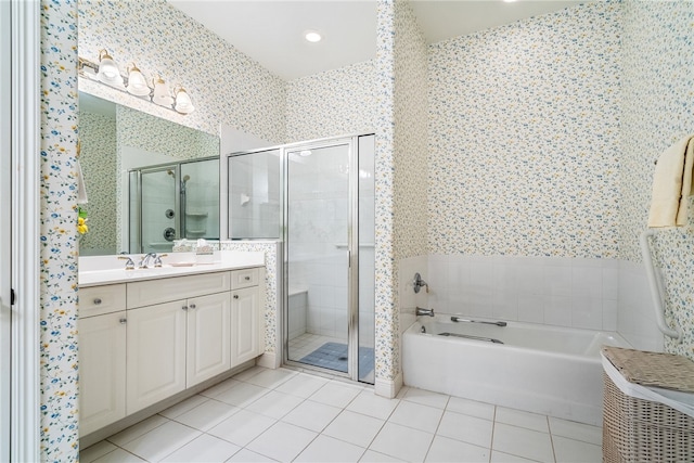 bathroom with tile patterned flooring, vanity, and independent shower and bath