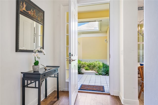 doorway to outside with hardwood / wood-style flooring