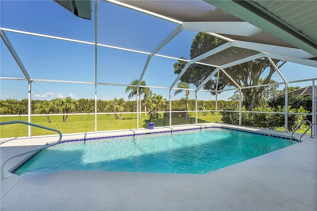 view of pool featuring a lanai, a lawn, and a patio area