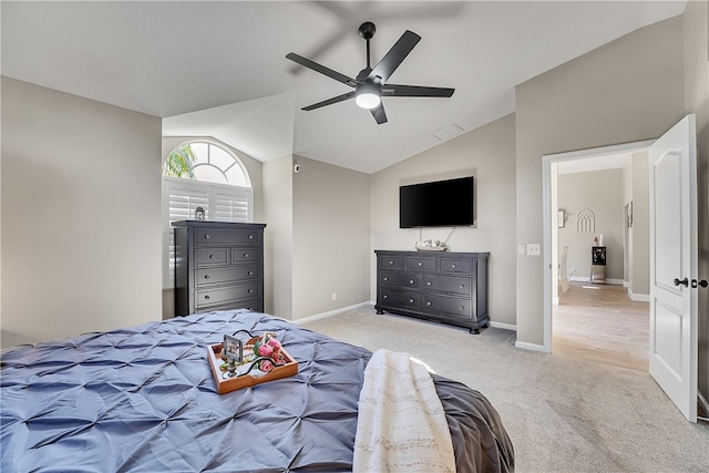 carpeted bedroom with lofted ceiling and ceiling fan