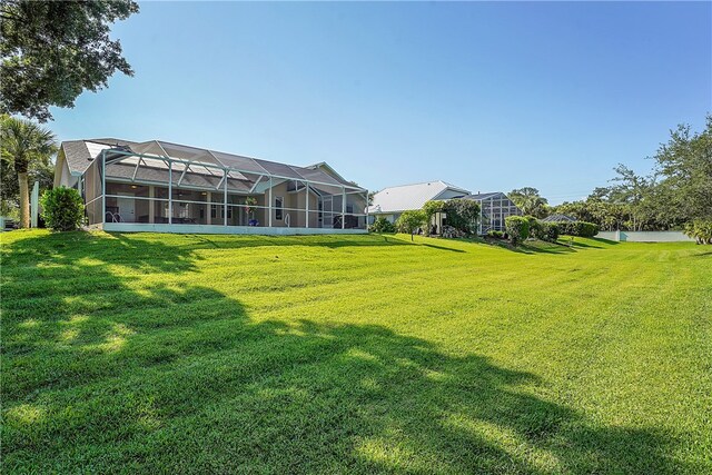 view of yard with a lanai