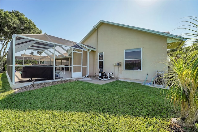 rear view of property with a lanai, a lawn, a patio area, and a pool