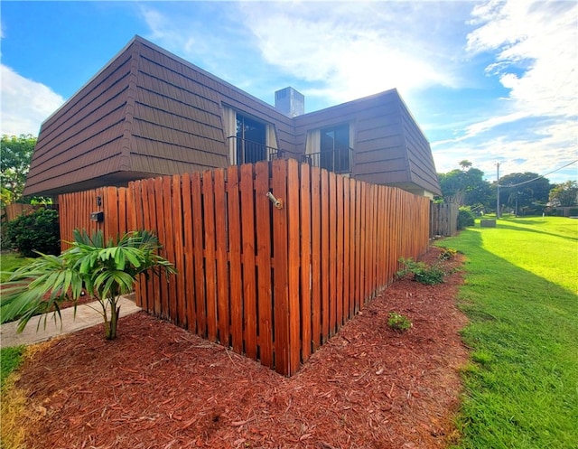 view of property exterior featuring a yard