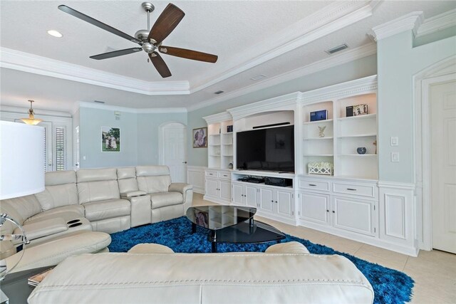 728 S Ocracoke Sq SW, Vero Beach, FL 32968 - living area featuring ornamental molding, ceiling fan, light tile patterned flooring, a raised ceiling, and arched walkways
