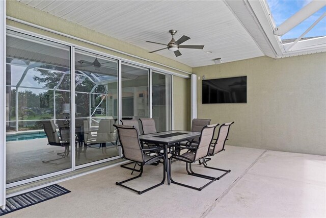 728 S Ocracoke Sq SW, Vero Beach, FL 32968 - view of patio with a ceiling fan, a lanai, outdoor dining space, and an outdoor pool