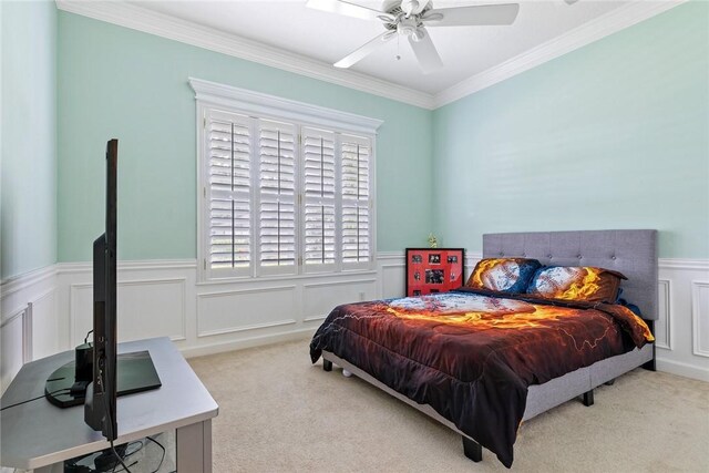 728 S Ocracoke Sq SW, Vero Beach, FL 32968 - bedroom featuring multiple windows, carpet floors, a wainscoted wall, ornamental molding, and a ceiling fan