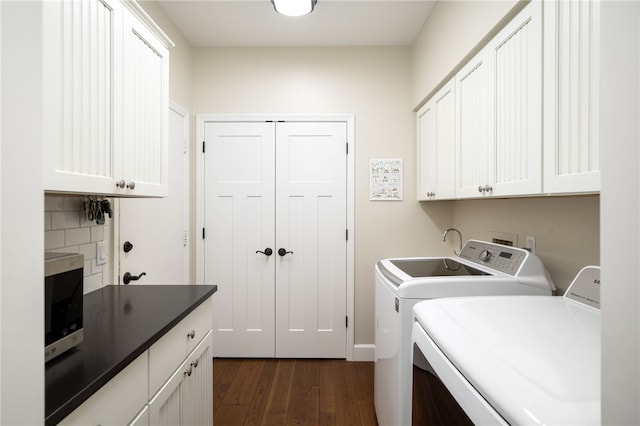 2139 Via Fuentes St Unit 2139, Vero Beach, FL 32963 - washroom featuring separate washer and dryer, cabinet space, and dark wood-type flooring