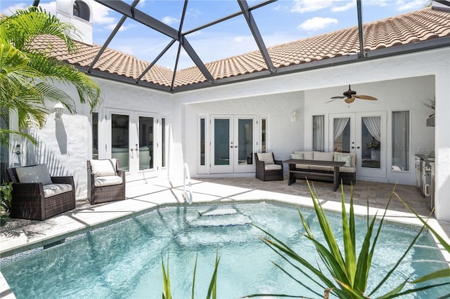 2139 Via Fuentes St Unit 2139, Vero Beach, FL 32963 - outdoor pool with french doors, ceiling fan, a patio area, an outdoor living space, and a lanai