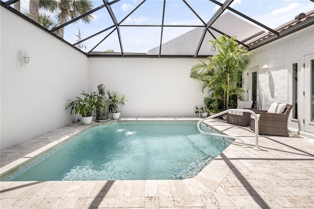 2139 Via Fuentes St Unit 2139, Vero Beach, FL 32963 - outdoor pool featuring a patio area, glass enclosure, and french doors