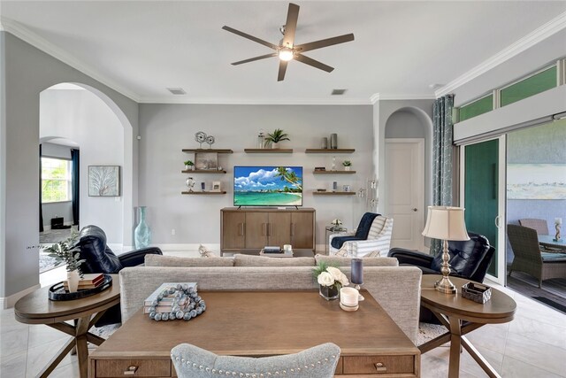 living room with ceiling fan, crown molding, and light tile patterned floors