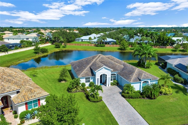 birds eye view of property with a water view