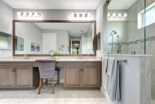 bathroom featuring vanity and a tile shower