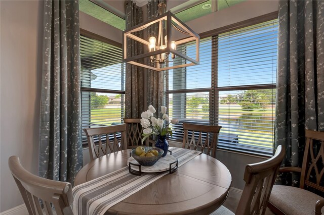 dining room with plenty of natural light and a chandelier