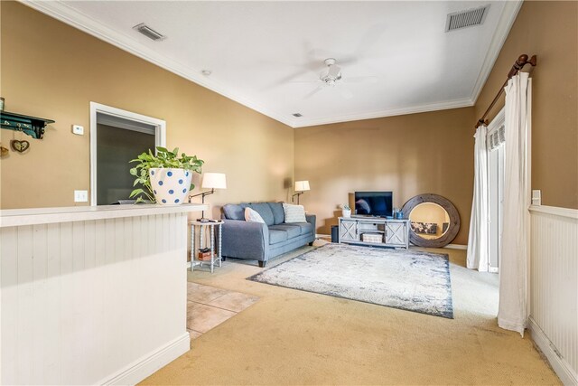 living room featuring visible vents, ornamental molding, and light colored carpet