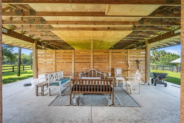 view of patio with an outbuilding and an exterior structure