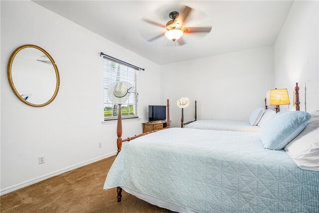 bedroom featuring carpet floors, ceiling fan, and baseboards