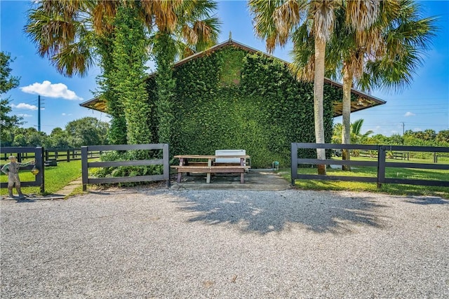 view of home's community with fence