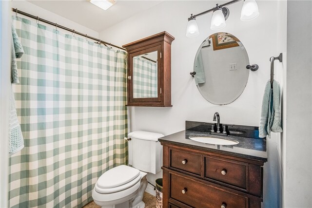 full bathroom with toilet and vanity