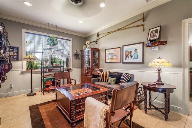 living area featuring light tile patterned floors, recessed lighting, wainscoting, and crown molding