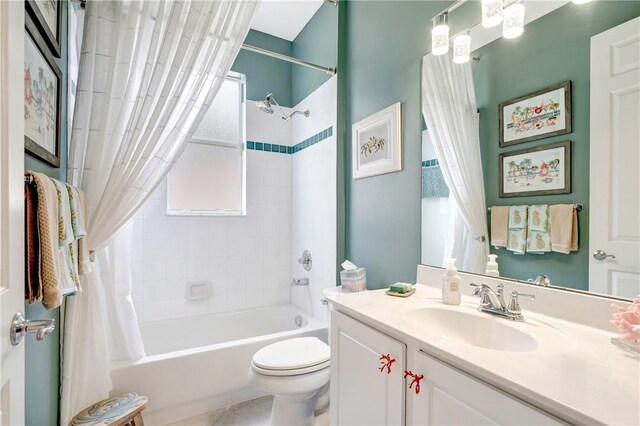 full bathroom featuring vanity, toilet, and shower / tub combo with curtain