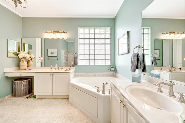 full bath featuring a garden tub, a stall shower, two vanities, a sink, and ornamental molding