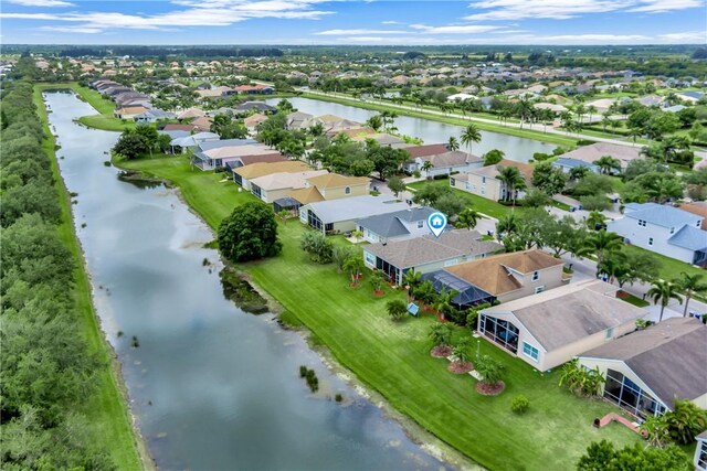 aerial view featuring a water view and a residential view