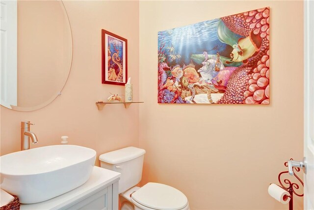 half bath with toilet and vanity