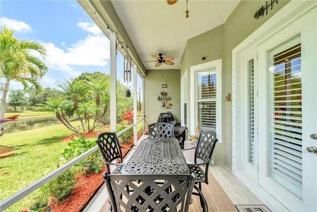 exterior space with a ceiling fan and outdoor dining space