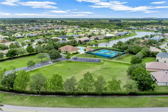 bird's eye view featuring a water view and a residential view