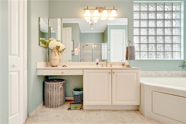full bath with vanity, a stall shower, a garden tub, and a wealth of natural light