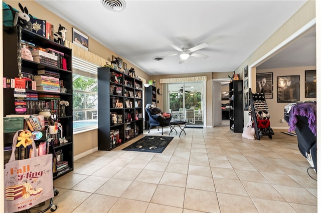 28 Sea Gull Ave, Vero Beach, FL 32960 - living area featuring tile patterned floors, visible vents, baseboards, and a ceiling fan