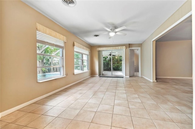 28 Sea Gull Ave, Vero Beach, FL 32960 - unfurnished room with visible vents, baseboards, a ceiling fan, and light tile patterned floors