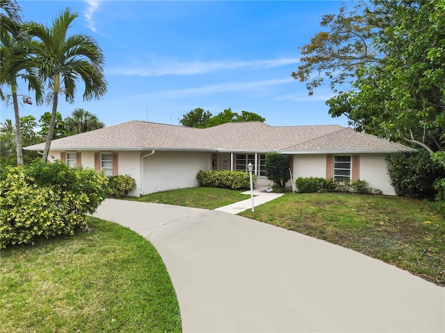 28 Sea Gull Ave, Vero Beach, FL 32960 - single story home with a front lawn and stucco siding