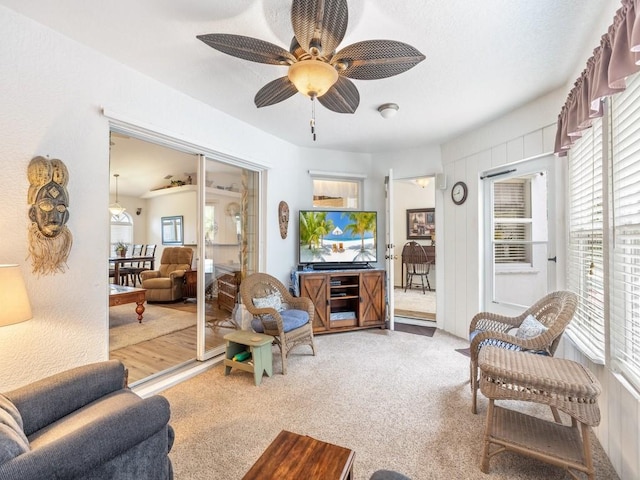 living room with carpet floors and ceiling fan