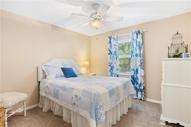 bedroom featuring light carpet and ceiling fan