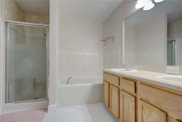 bathroom with vanity and independent shower and bath