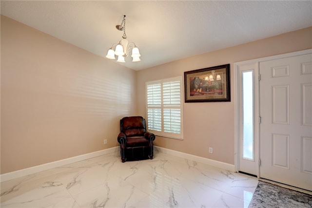 foyer with a notable chandelier