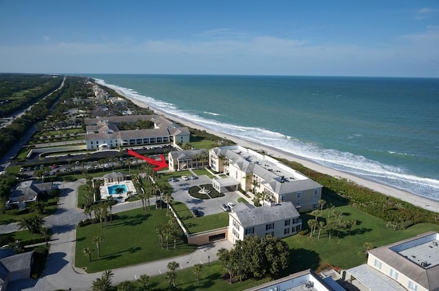 birds eye view of property featuring a water view and a view of the beach