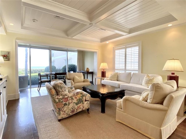 living room with hardwood / wood-style flooring, crown molding, a healthy amount of sunlight, and beam ceiling