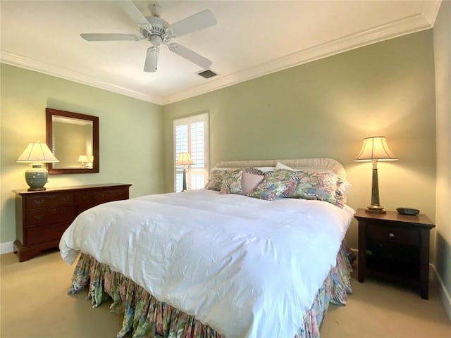 bedroom featuring crown molding, light carpet, and ceiling fan