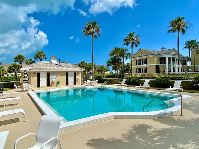 view of swimming pool featuring a patio area